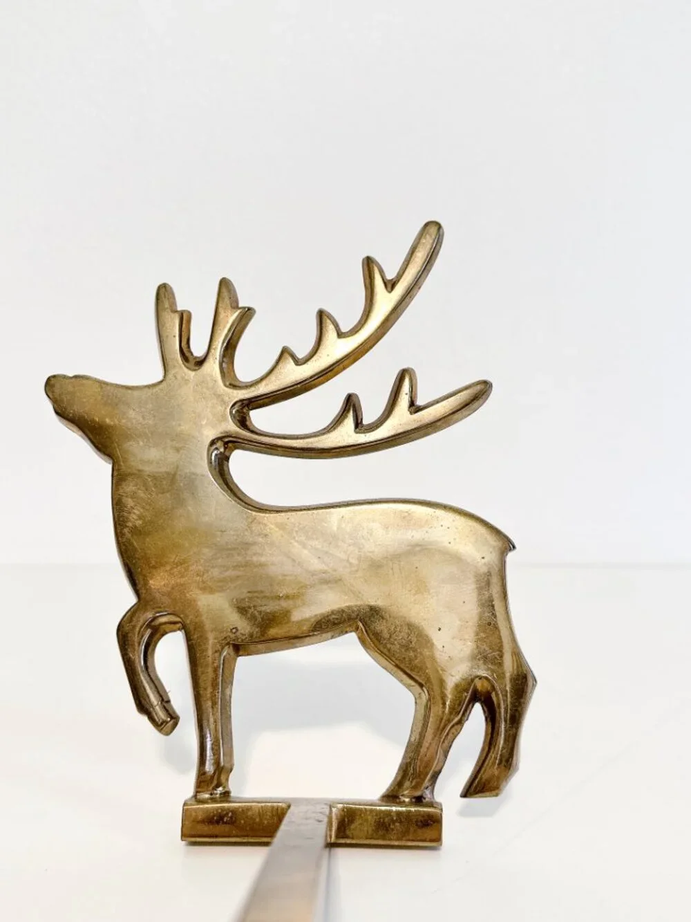 SET OF FOUR BRASS REINDEER MANTEL STOCKING HANGERS